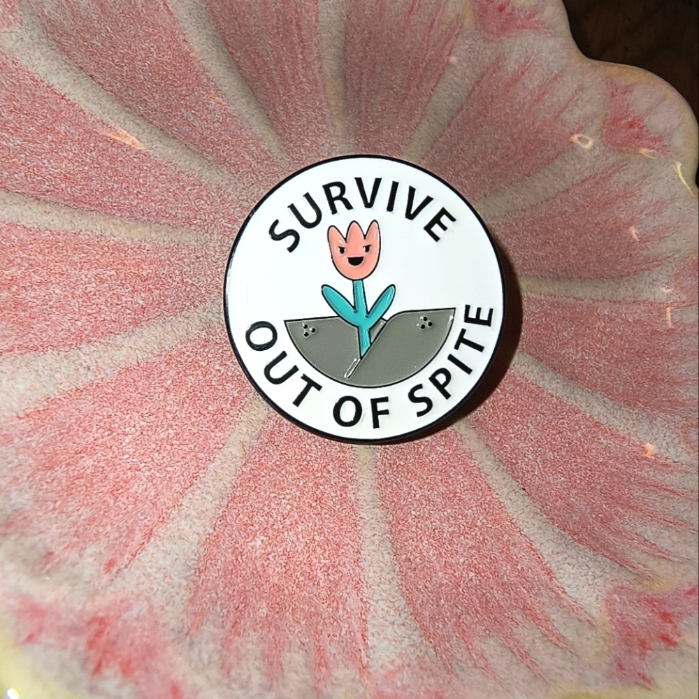 White with pink flower says Survive Out of Spite enamel pin clothes bag hat cap